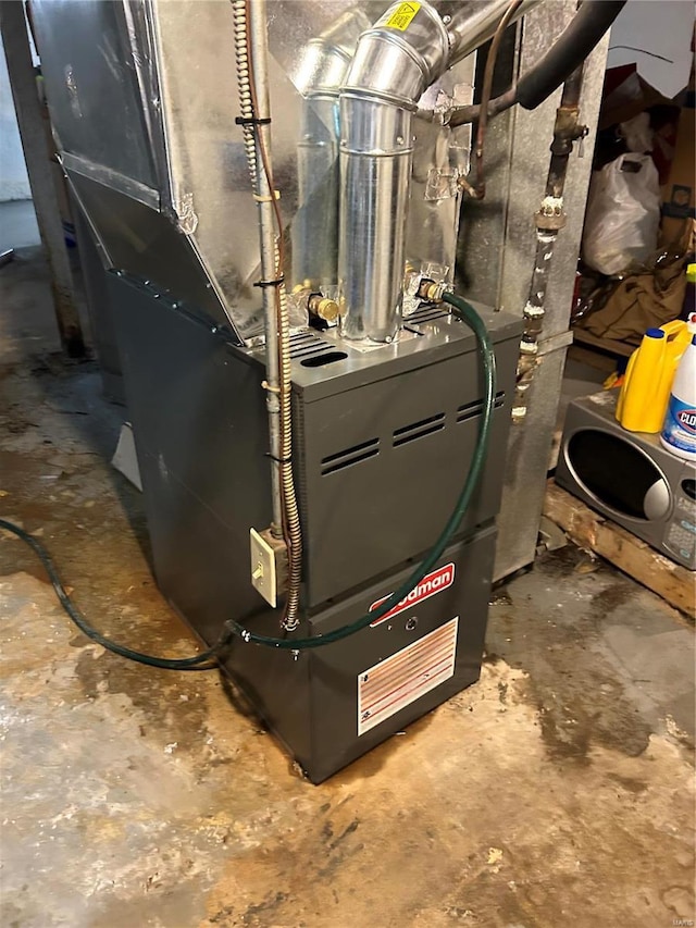 utility room featuring heating unit