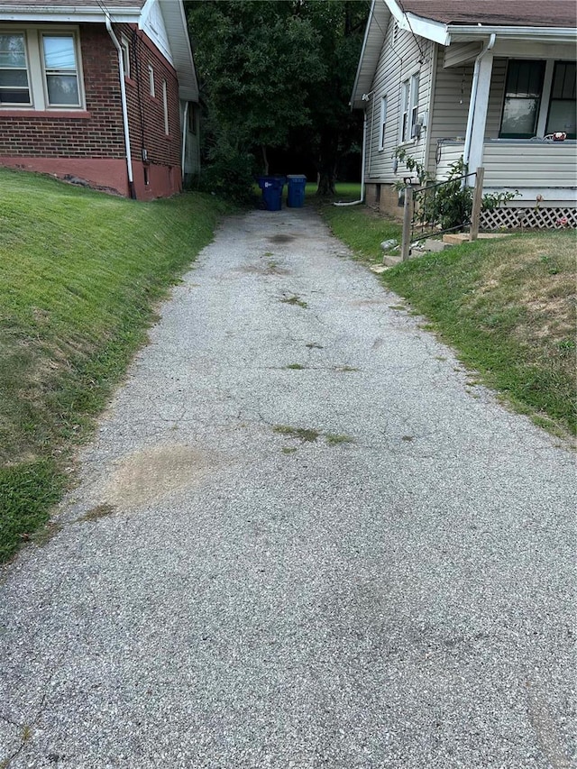 view of side of property with a yard