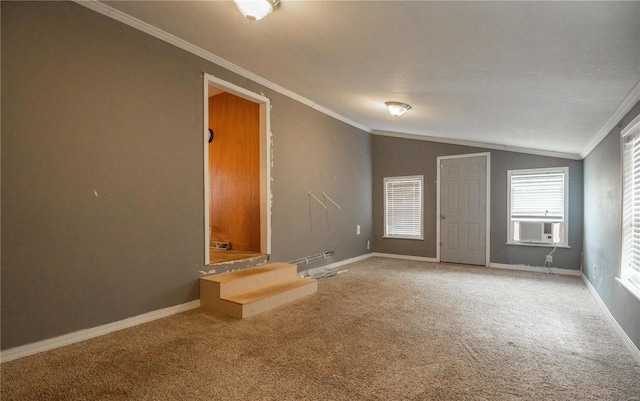 carpeted empty room with cooling unit, lofted ceiling, and ornamental molding