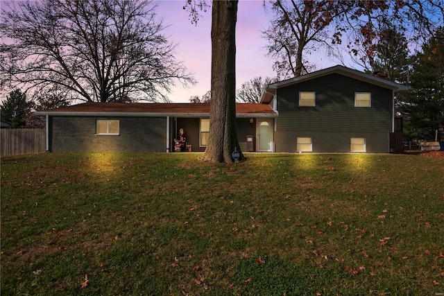 view of front of property with a lawn