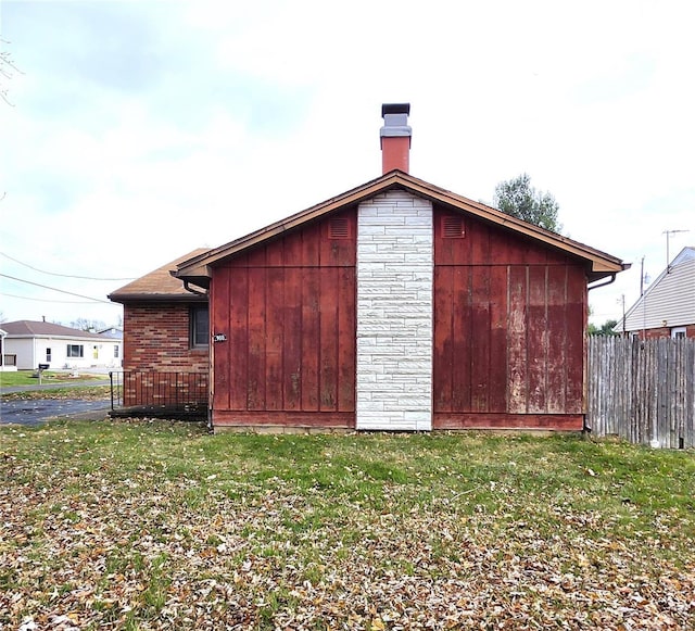 view of outdoor structure featuring a lawn