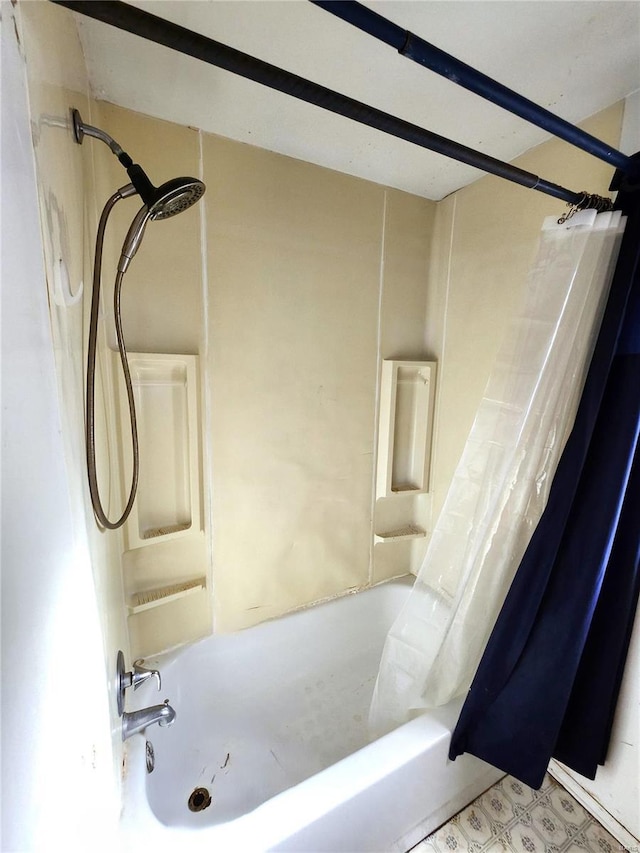 bathroom with shower / bathtub combination with curtain