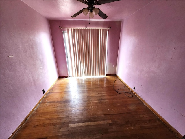 spare room featuring ceiling fan and wood-type flooring