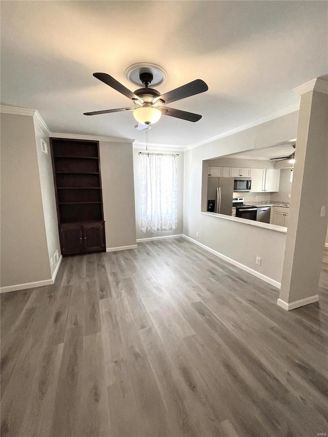 unfurnished living room featuring crown molding, ceiling fan, and wood-type flooring