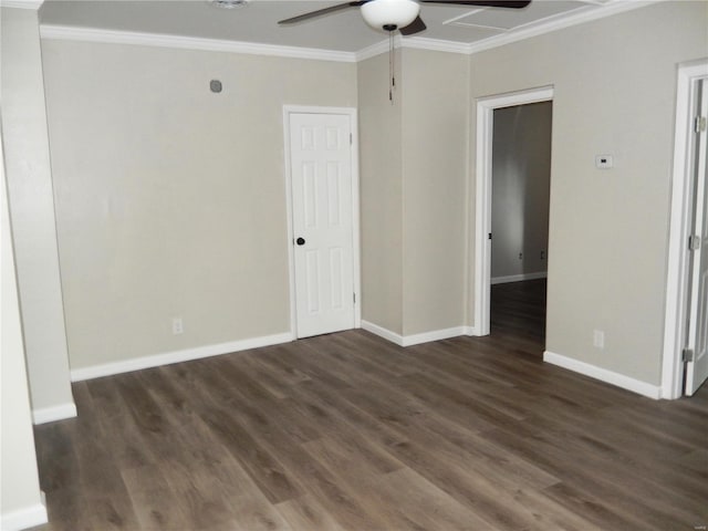 empty room featuring crown molding, dark hardwood / wood-style flooring, and ceiling fan