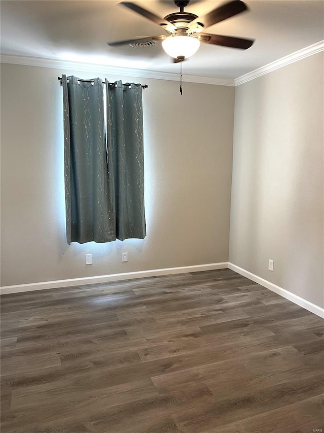 unfurnished room featuring ceiling fan, ornamental molding, and dark wood-type flooring