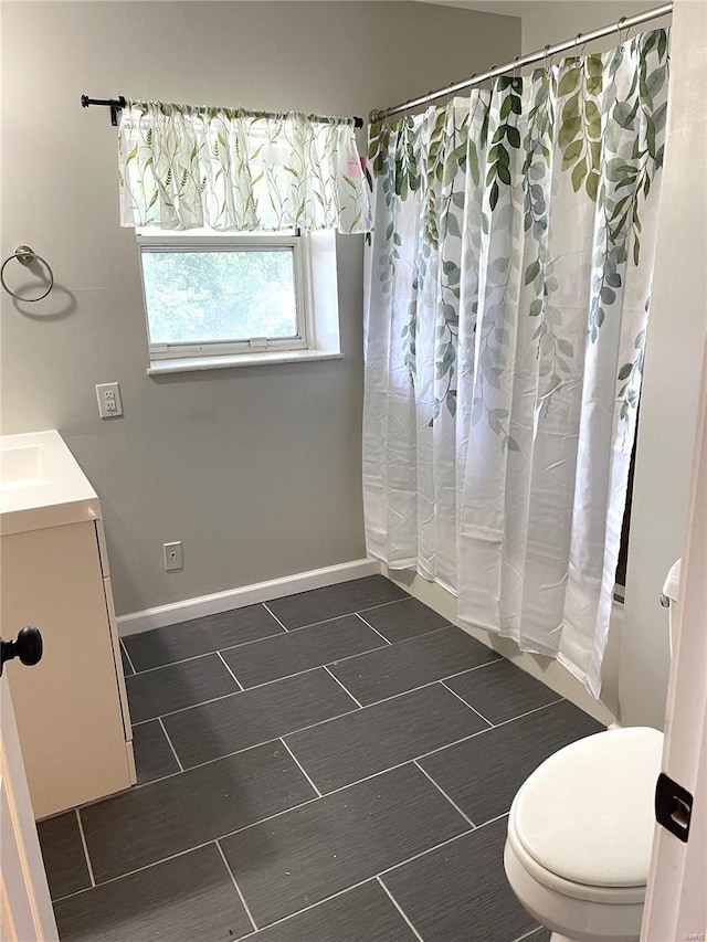 full bathroom featuring vanity, toilet, and shower / bath combo with shower curtain