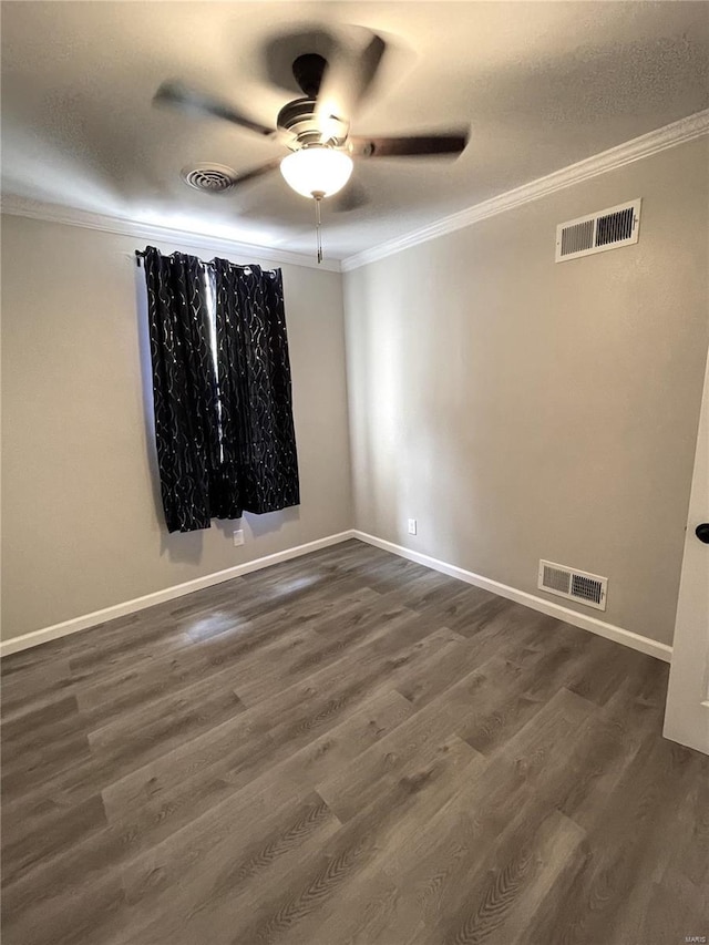 spare room featuring ceiling fan, dark hardwood / wood-style flooring, and ornamental molding