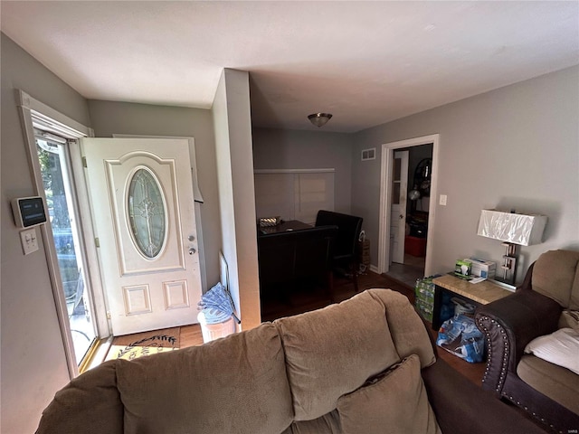 foyer entrance with hardwood / wood-style floors