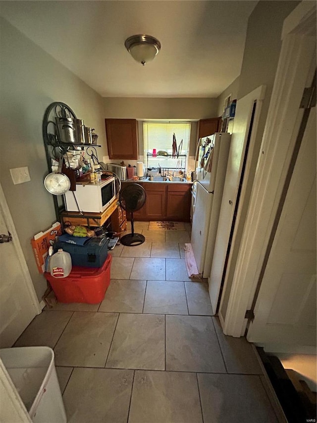 bathroom with tile patterned floors