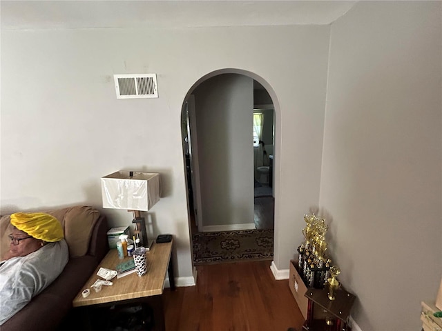 living room featuring dark hardwood / wood-style flooring