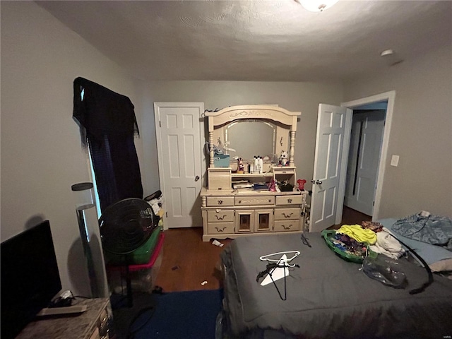 bedroom featuring dark wood-type flooring