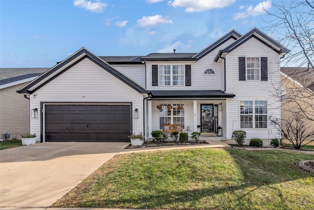 view of front of property featuring covered porch, a garage, and a front lawn