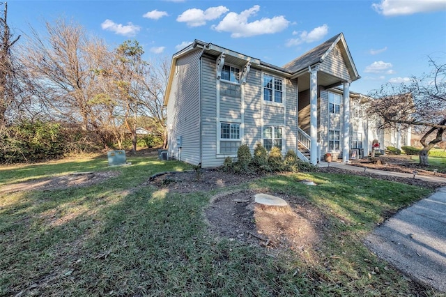 view of property exterior with a lawn