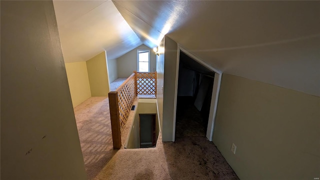 bonus room featuring vaulted ceiling and carpet