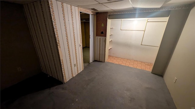 basement featuring a drop ceiling