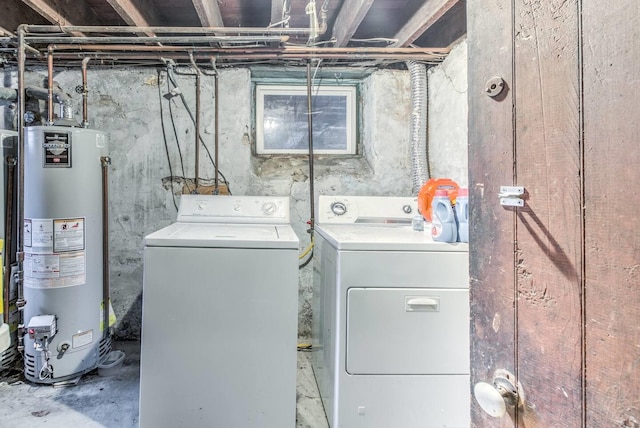 washroom with washer and clothes dryer and gas water heater