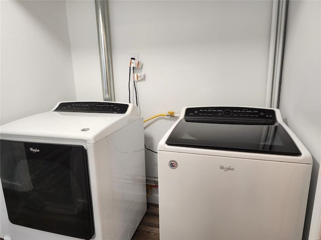 laundry area featuring hardwood / wood-style floors and washer and clothes dryer