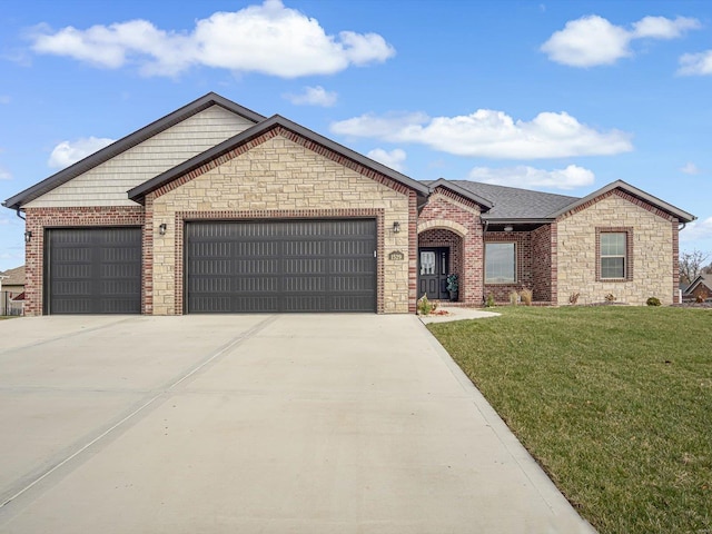 view of front of property featuring a garage and a front lawn