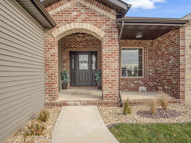 entrance to property featuring a porch