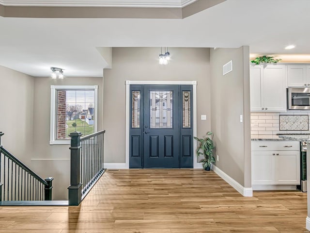 entrance foyer with light wood-type flooring