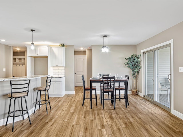 dining space featuring light hardwood / wood-style floors