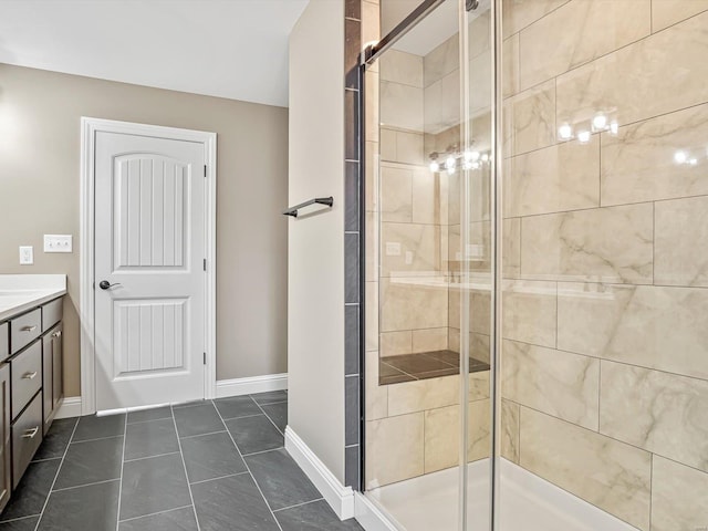 bathroom featuring tile patterned flooring, vanity, and a shower with door