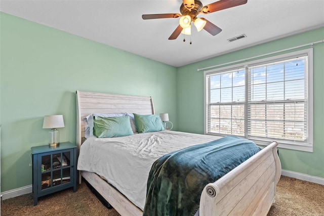 bedroom with a ceiling fan, carpet, visible vents, and baseboards