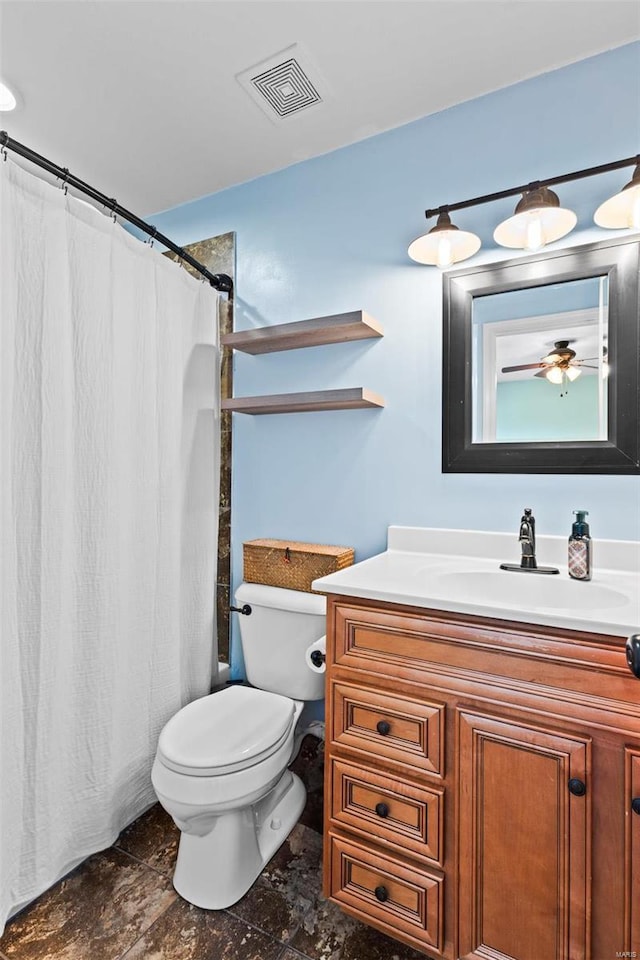 bathroom with a shower with curtain, visible vents, vanity, and toilet