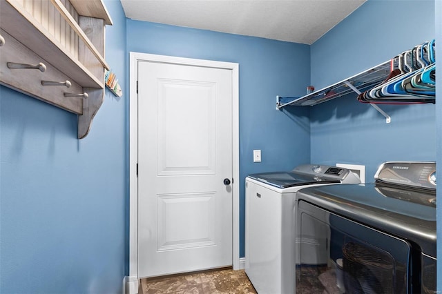 washroom with laundry area and washer and clothes dryer