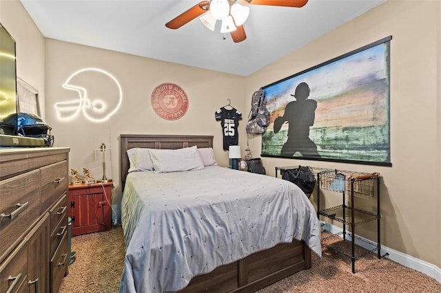 bedroom featuring a ceiling fan, carpet, and baseboards