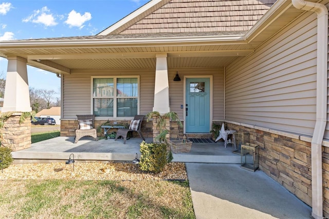 entrance to property featuring covered porch