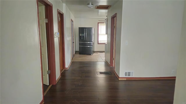 hall with dark hardwood / wood-style flooring