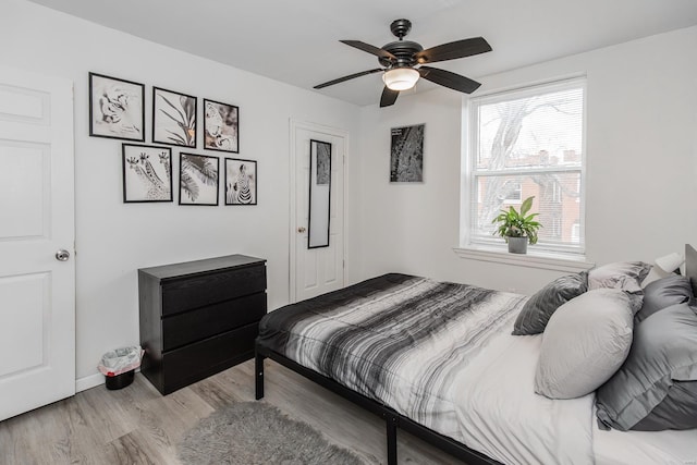 bedroom featuring light hardwood / wood-style flooring and ceiling fan