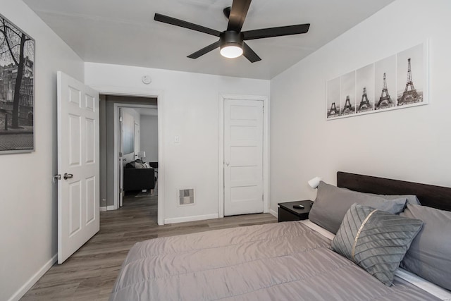 bedroom featuring hardwood / wood-style floors and ceiling fan