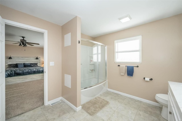 full bathroom with vanity, bath / shower combo with glass door, tile patterned flooring, ceiling fan, and toilet