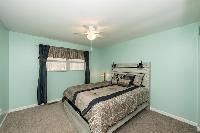 bedroom featuring ceiling fan and carpet