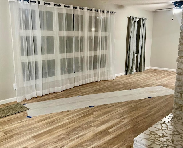 interior space featuring ceiling fan and hardwood / wood-style floors