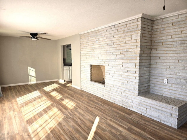 unfurnished living room featuring hardwood / wood-style flooring, a textured ceiling, and ceiling fan