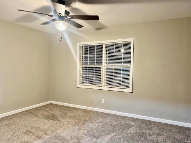 carpeted empty room with ceiling fan