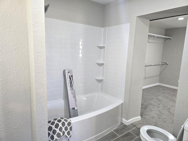 bathroom featuring toilet and shower / bath combo with shower curtain