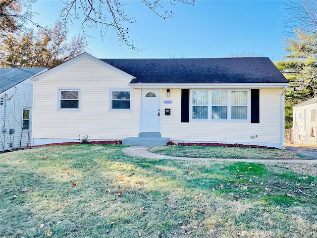 single story home featuring a front yard