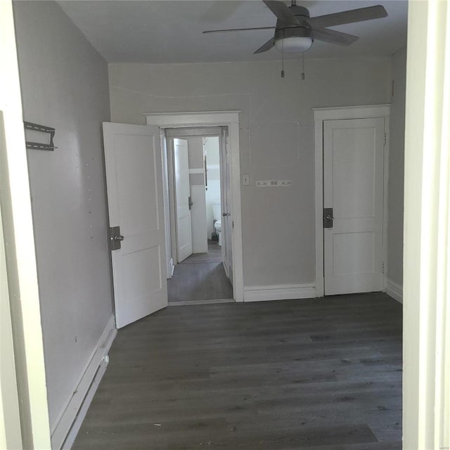 corridor featuring dark hardwood / wood-style floors