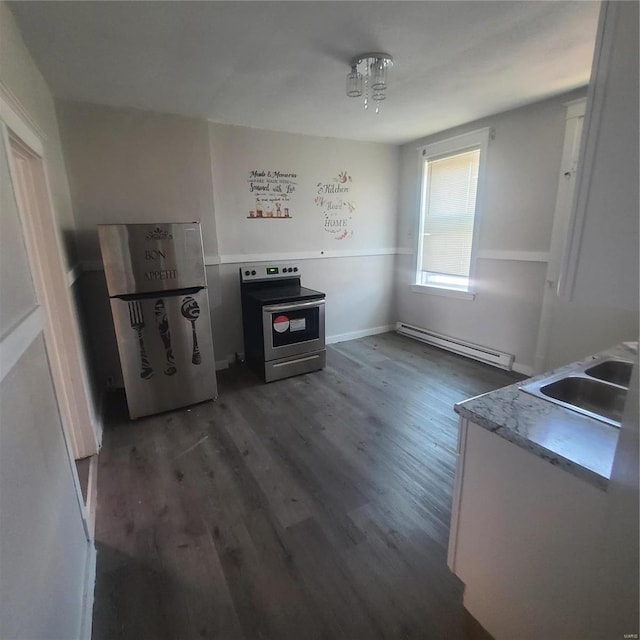 kitchen with dark hardwood / wood-style flooring, electric range, baseboard heating, and sink