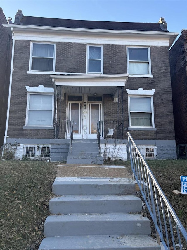 view of property with a porch