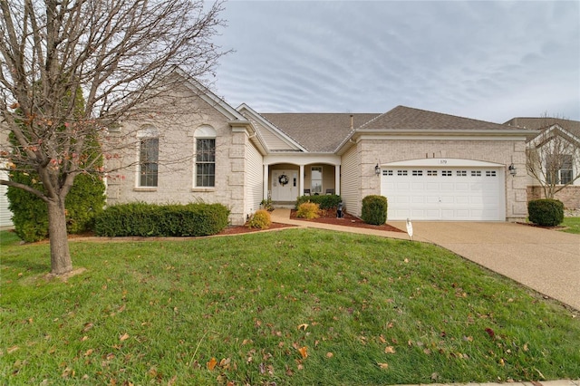 view of front of home featuring a garage and a front yard