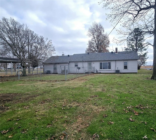 back of property with a yard and cooling unit