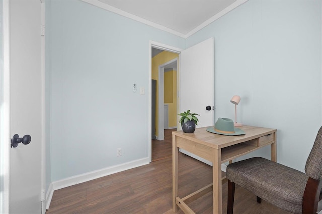 office area with dark wood-type flooring and ornamental molding