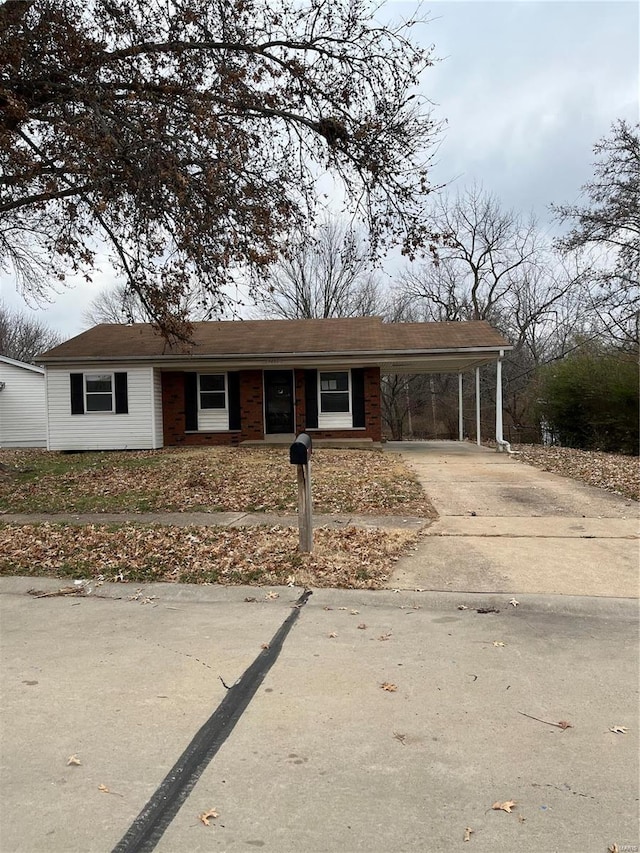 ranch-style home with a carport