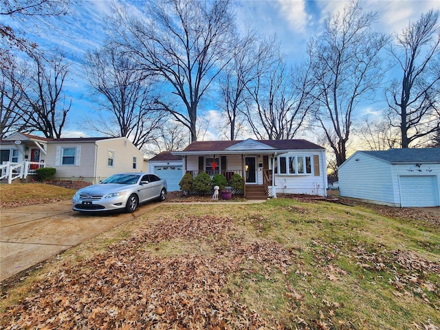 single story home with concrete driveway, a porch, and a front lawn